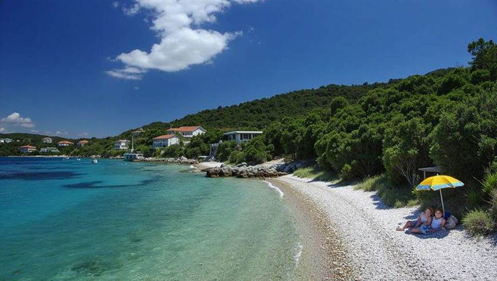 Agua y arena en Tri žala, Grad Korčula